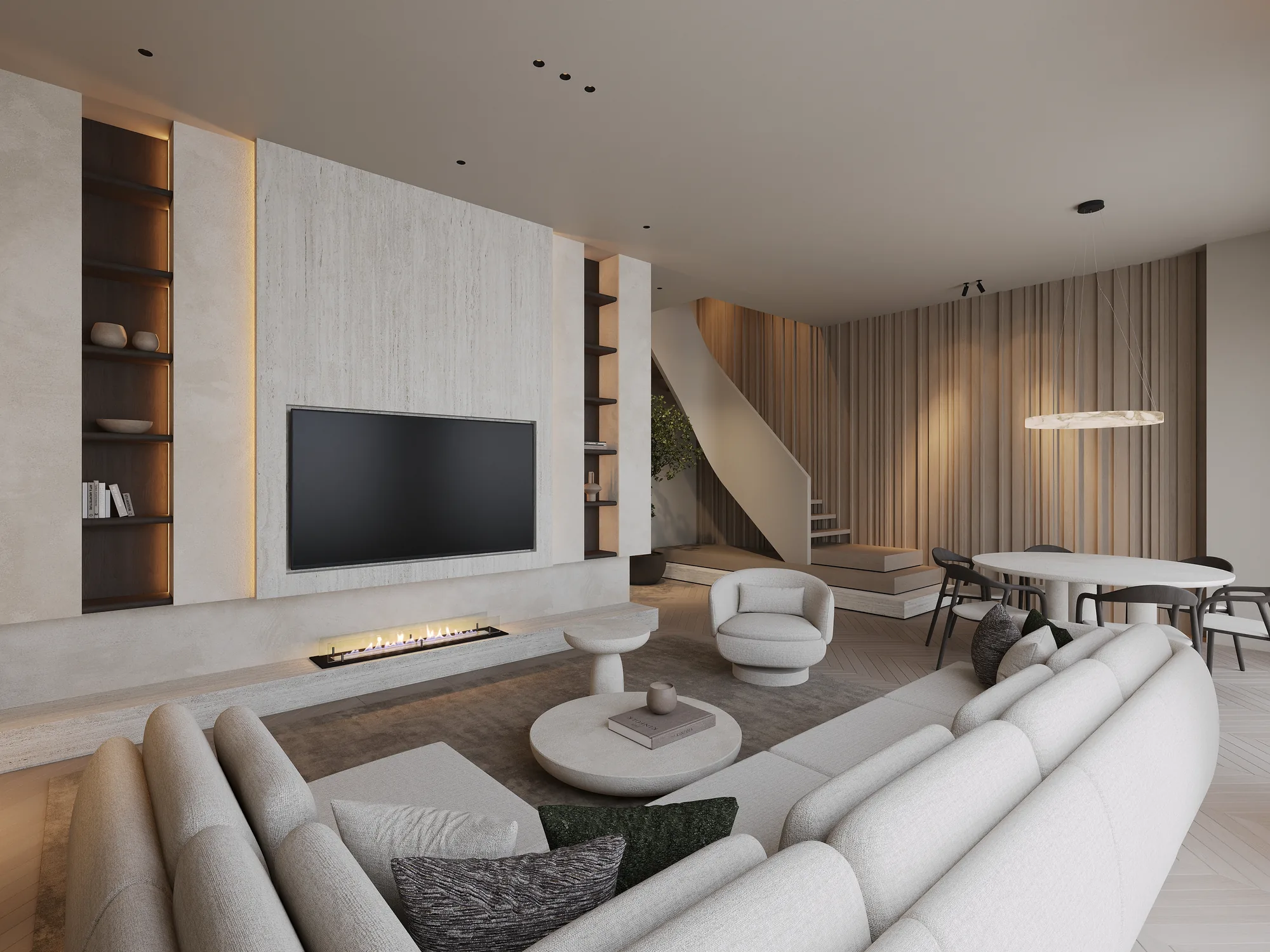 Woonkamer met haard, lamellenwand en de trap op de achtergrond